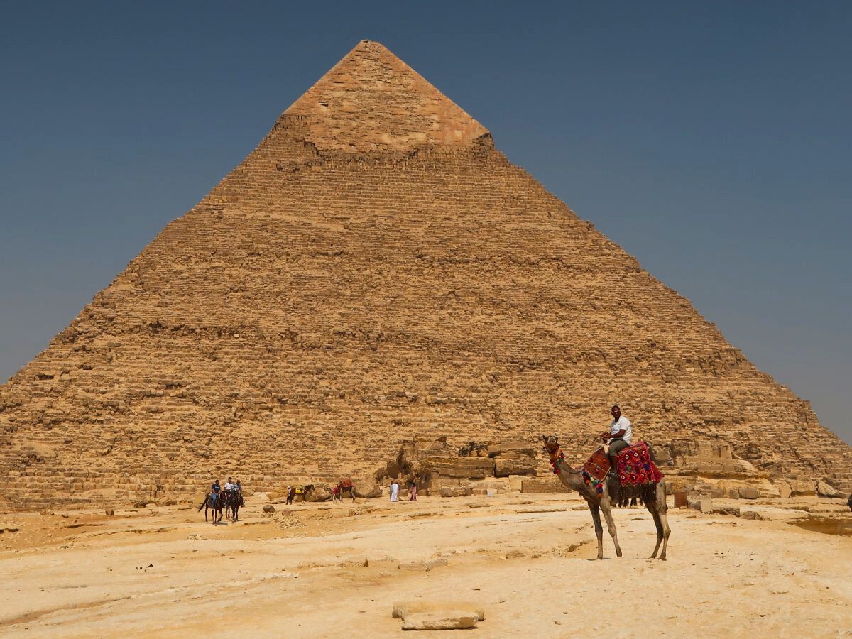 the man on the camel in front of the Great Pyramid of Giza