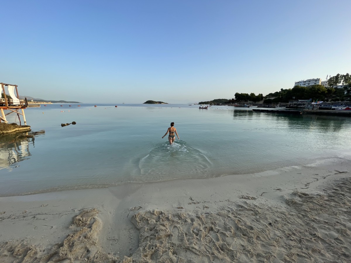 Early morning swimming alone on the empty beach in Ksamil