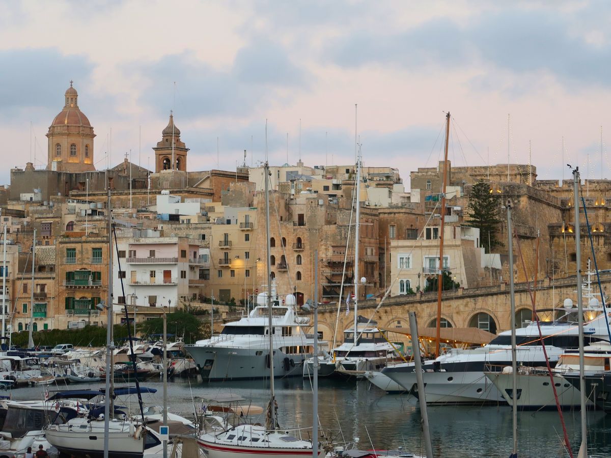 Birgu Waterfront with expensive yachts and historical buildings