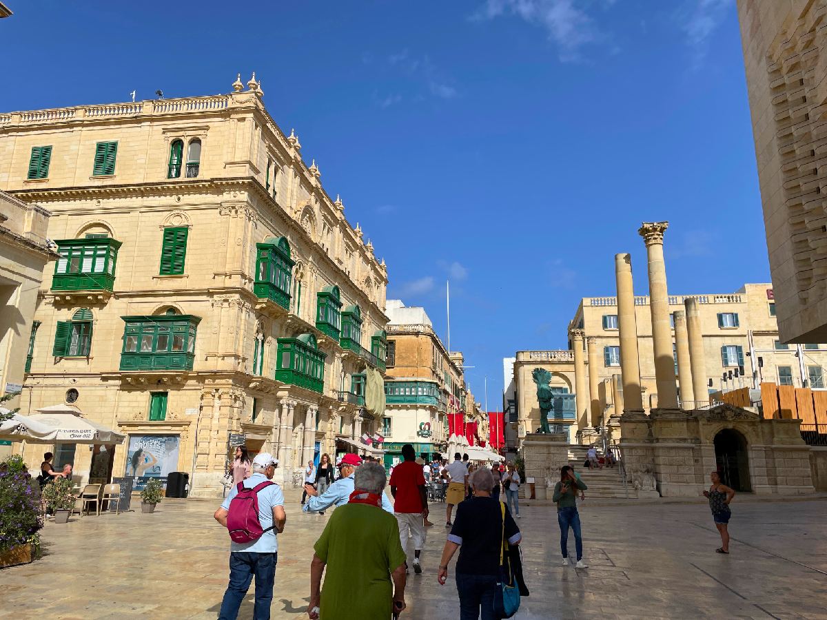 Palazzo Ferreria with green balconies during the day on October with few tourists