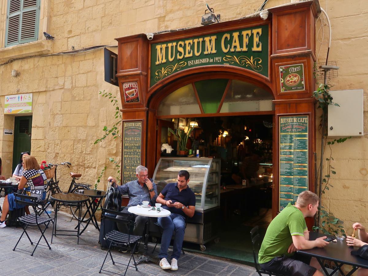 people are having a breakfast in a Museum Cafe in Valletta