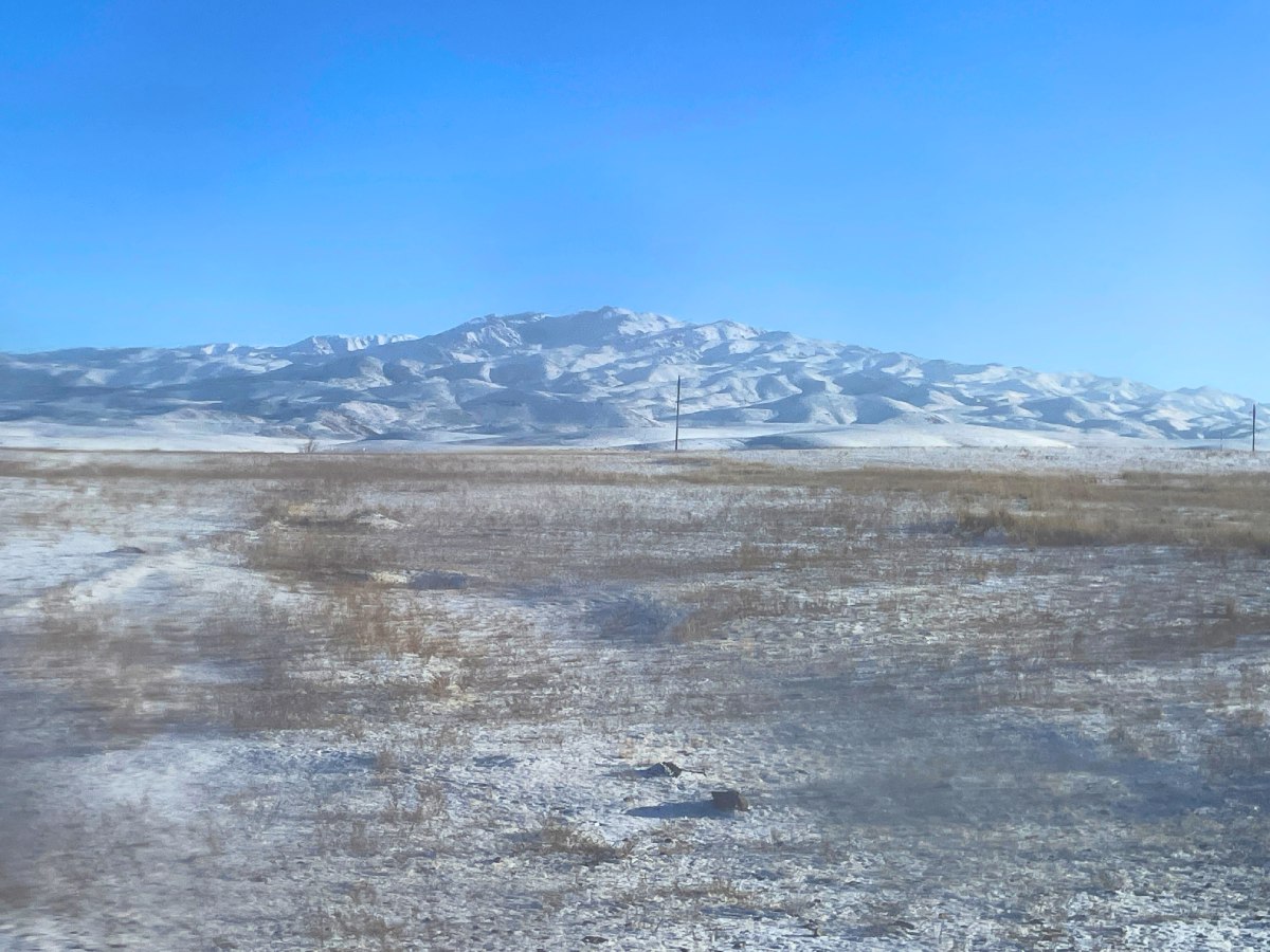 view from a bus almaty to bishkek through dirty window